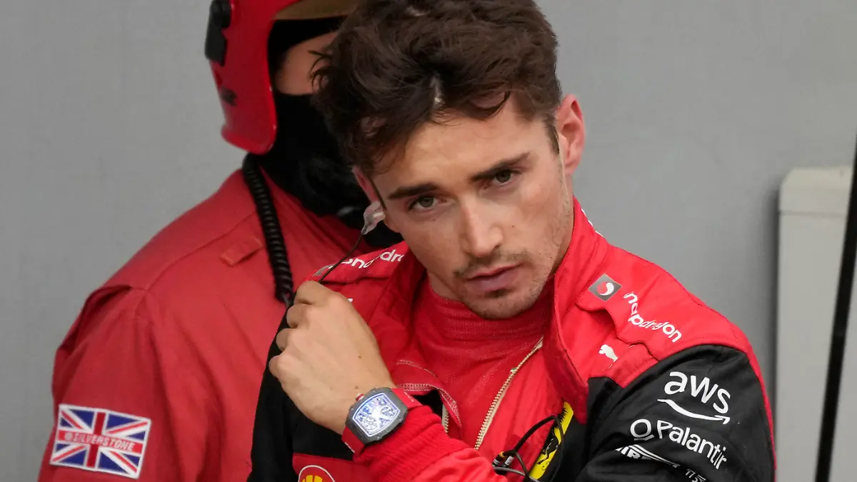 Ferrari driver Charles Leclerc of Monaco stands at the end of the Emilia Romagna Formula One Grand Prix, at the Enzo and Dino Ferrari racetrack, in Imola, Italy, Sunday, April 24, 2022. (AP Photo/Luca Bruno)