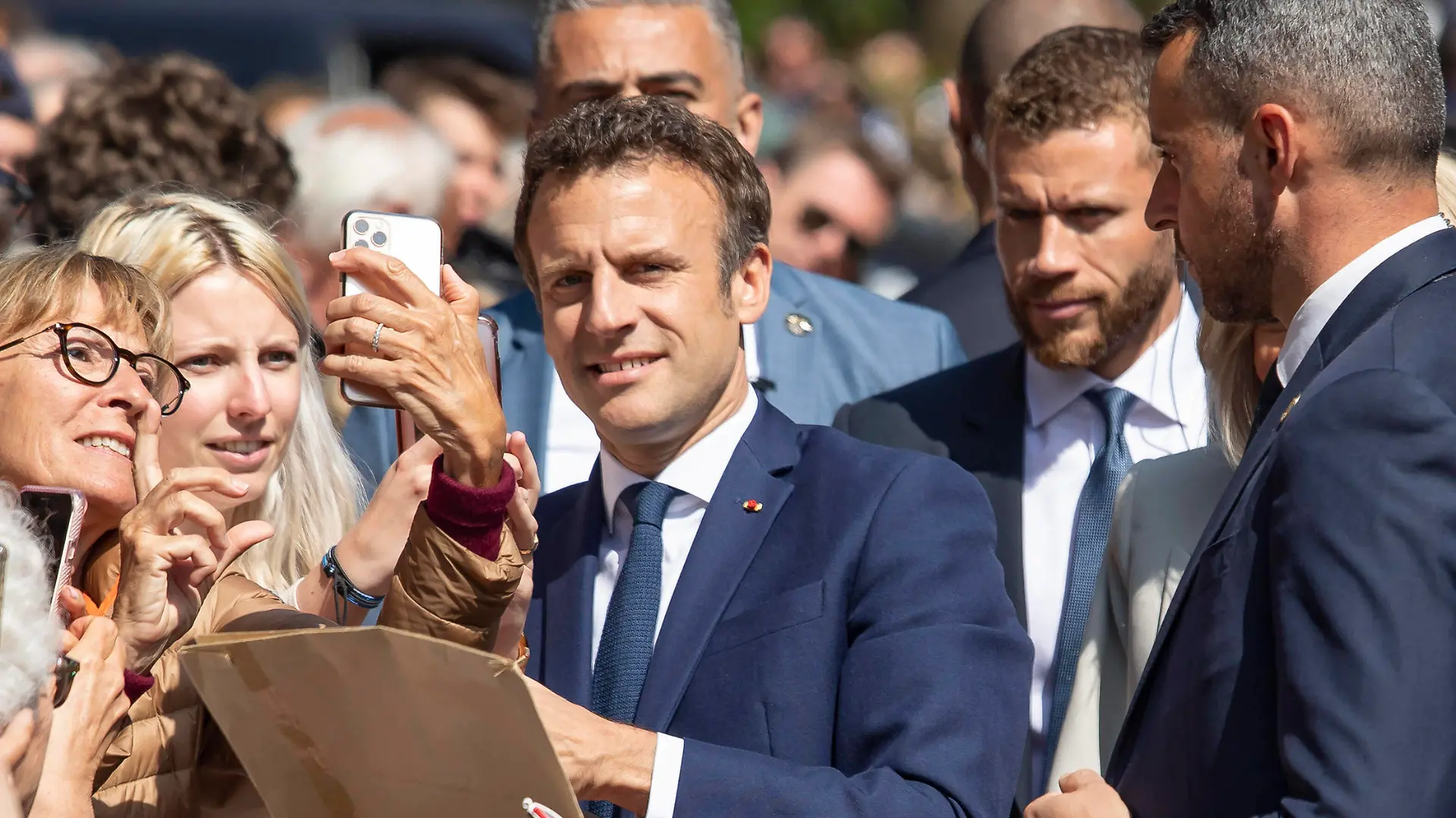 220424 -- LE TOUQUET, April 24, 2022 -- French President Emmanuel Macron poses for photos with his supporters before casting his ballot in Le Touquet, northern France, April 24, 2022. The 2022 French presidential runoff kicked off at 8 a.m. local time 0600 GMT on Sunday in Metropolitan France between incumbent President Emmanuel Macron and candidate Marine Le Pen. Photo by /Xinhua FRANCE-LE TOUQUET-PRESIDENTIAL ELECTION-SECOND ROUND-VOTE-MACRON AngelinixHans PUBLICATIONxNOTxINxCHN