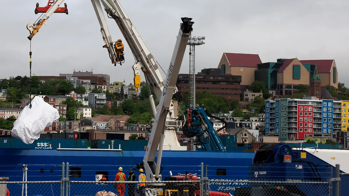 THE CANADIAN PRESS 2023-06-28. Debris from the Titan submersible, recovered from the ocean floor near the wreck of the Titanic, is unloaded from the ship Horizon Arctic at the Canadian Coast Guard pier in St. JohnÄôs on Wednesday, June 28, 2023. THE CANADIAN PRESS/Paul Daly URN:72791913