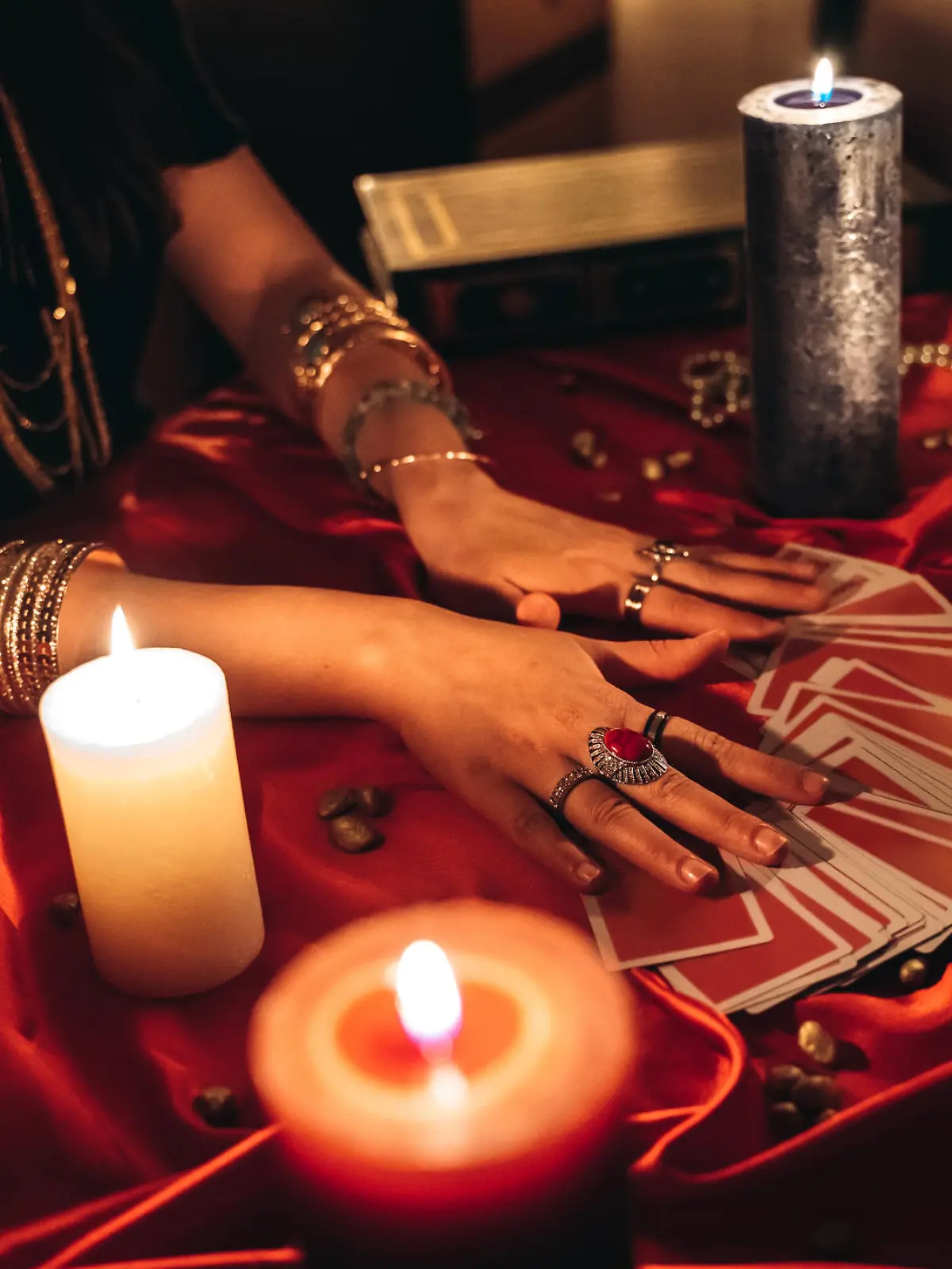 Young female fortune teller reading tarot.