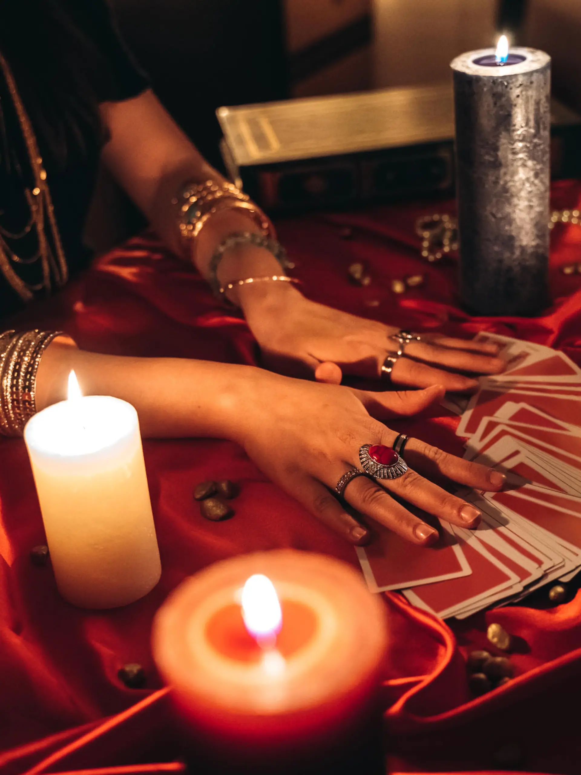 Young female fortune teller reading tarot.