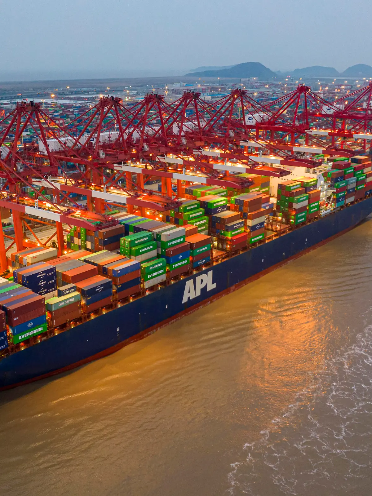 SHANGHAI, CHINA - FEBRUARY 2, 2022 - An aerial photo taken on February 2, 2022 shows large container ships in operation at Yangshan Port in Shanghai, China. In January 2022, the container throughput of Shanghai Port exceeded 4.35 million TEUS, a record monthly high.
