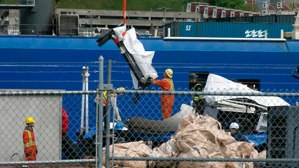 Debris from the Titan submersible, recovered from the ocean floor near the wreck of the Titanic, is unloaded from the ship Horizon Arctic at the Canadian Coast Guard pier in St. John's, Newfoundland, Wednesday, June 28, 2023. (Paul Daly/The Canadian Press via AP)