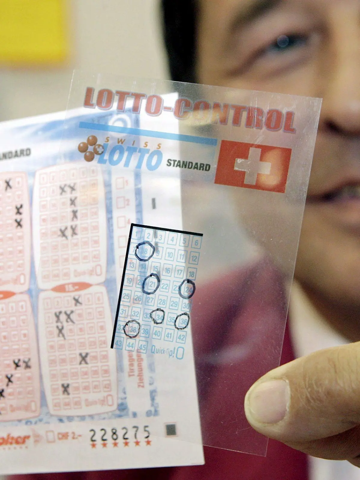epa00986994 Swiss Jean-Marc Aviolat presents his invention, the 'Lotto Control' for easy and fast control of the lotto bulletins, at the 35th International Exhibition of Inventions, New Techniques and Products, in Geneva, Switzerland, 18 April 2007. 700 exhibitors from around the world are presenting around 1000 products hoping to catch the eye at the 35th International Exhibition of Inventions, which runs from April 18-22. EPA/SALVATORE DI NOLFI