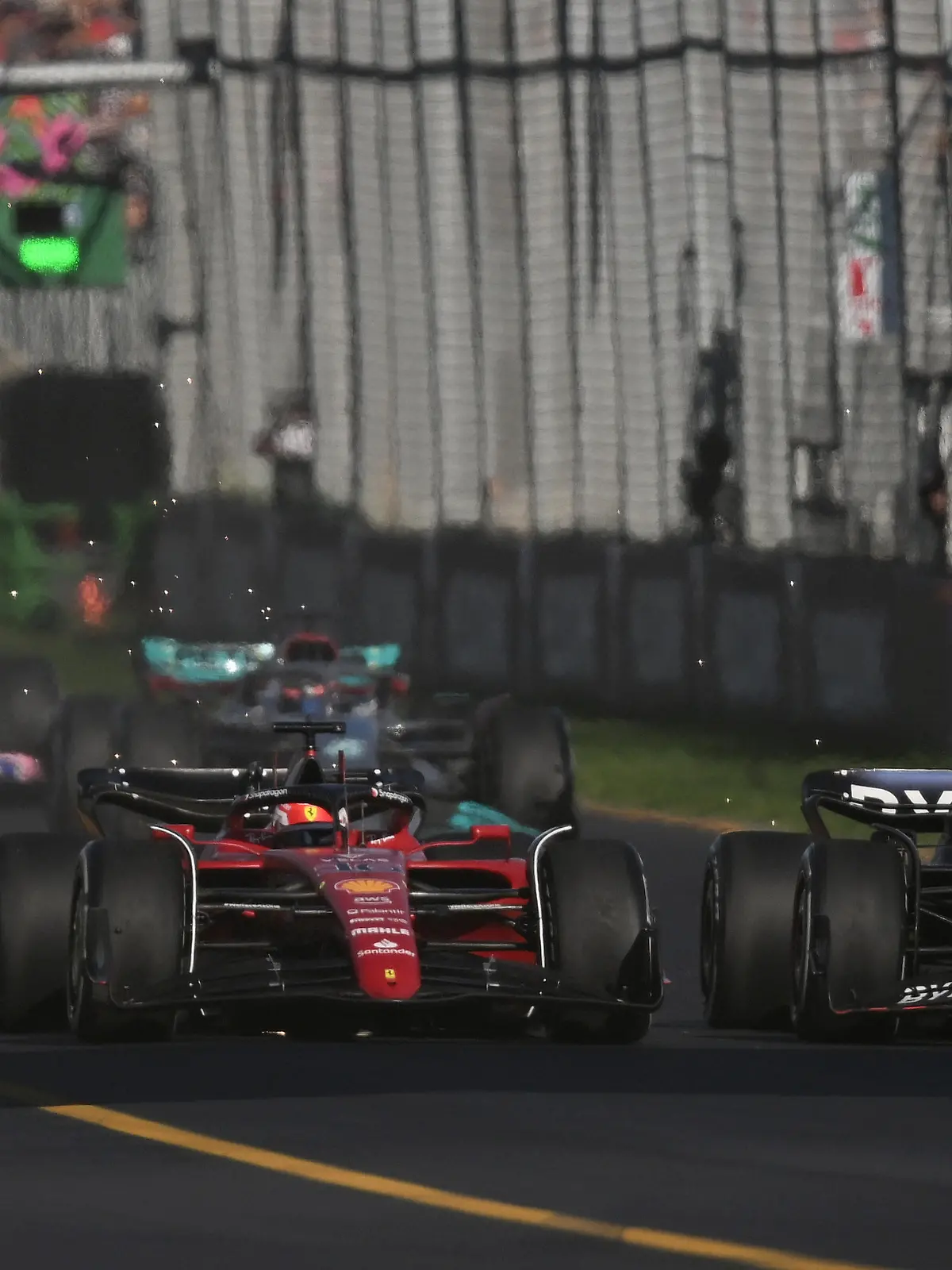 10th April 2022, Albert Park, Melbourne, Australia; FIA Formula 1 Australian Grand Prix, Race Day: Charles Leclerc of Monaco and Ferrari and Max Verstappen of the Netherlands and Red Bull Racing compete for the lead after a safety car during the Australian Grand Prix