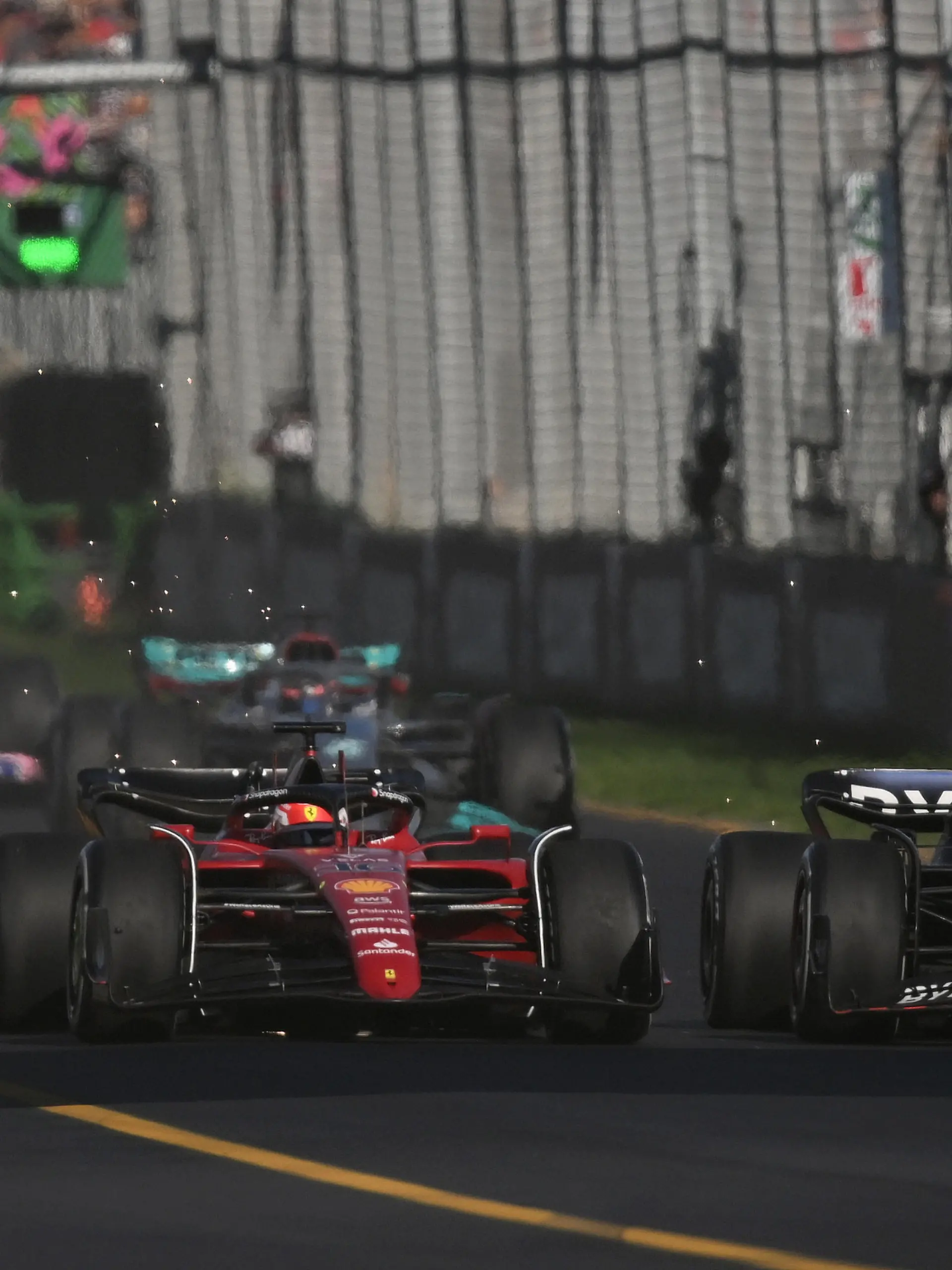 10th April 2022, Albert Park, Melbourne, Australia; FIA Formula 1 Australian Grand Prix, Race Day: Charles Leclerc of Monaco and Ferrari and Max Verstappen of the Netherlands and Red Bull Racing compete for the lead after a safety car during the Australian Grand Prix