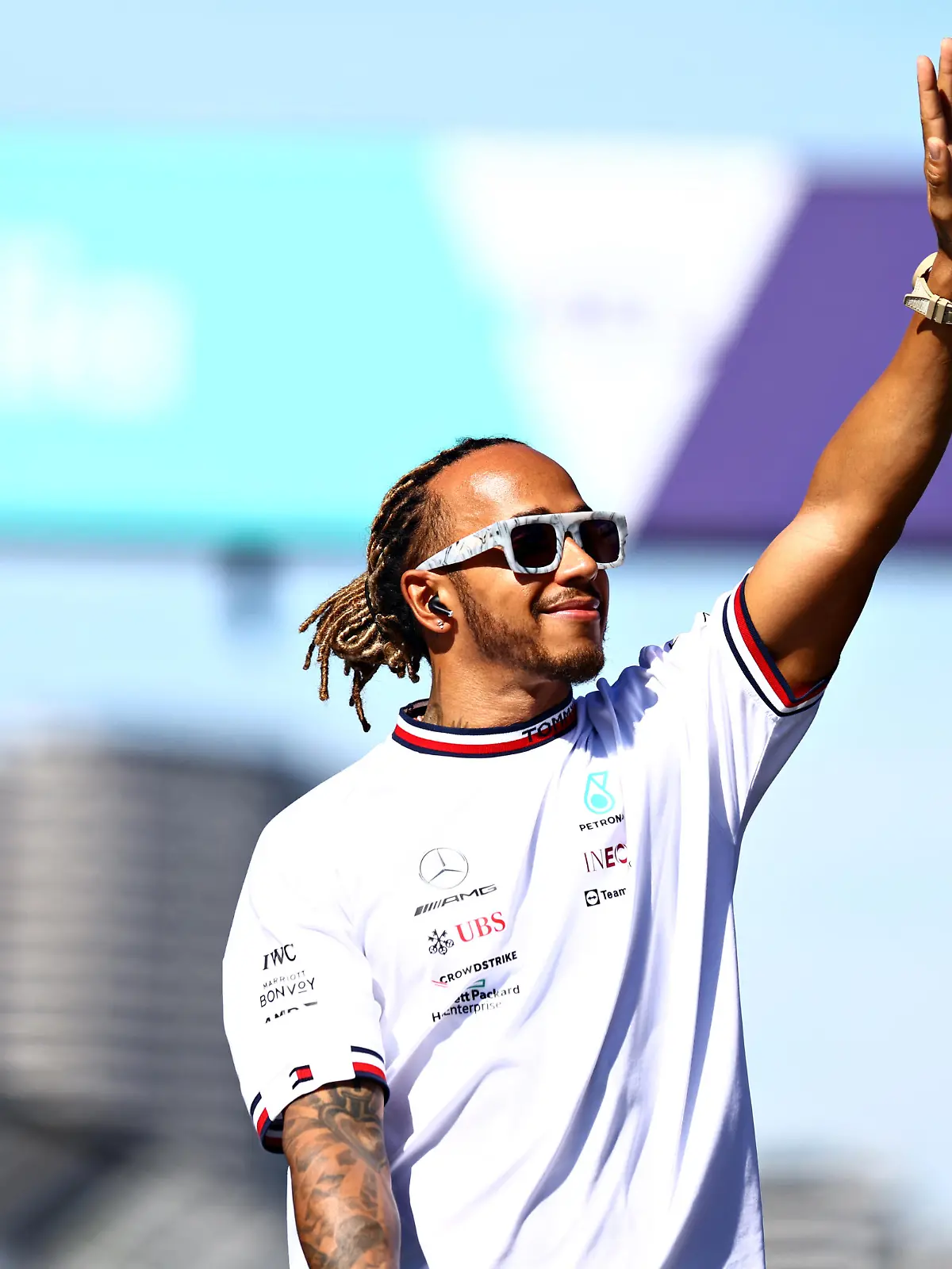MELBOURNE, AUSTRALIA - APRIL 10: Lewis Hamilton of Great Britain and Mercedes waves to the crowd on the drivers parade ahead of the F1 Grand Prix of Australia at Melbourne Grand Prix Circuit on April 10, 2022 in Melbourne, Australia. (Photo by Mark Thompson/Getty Images)