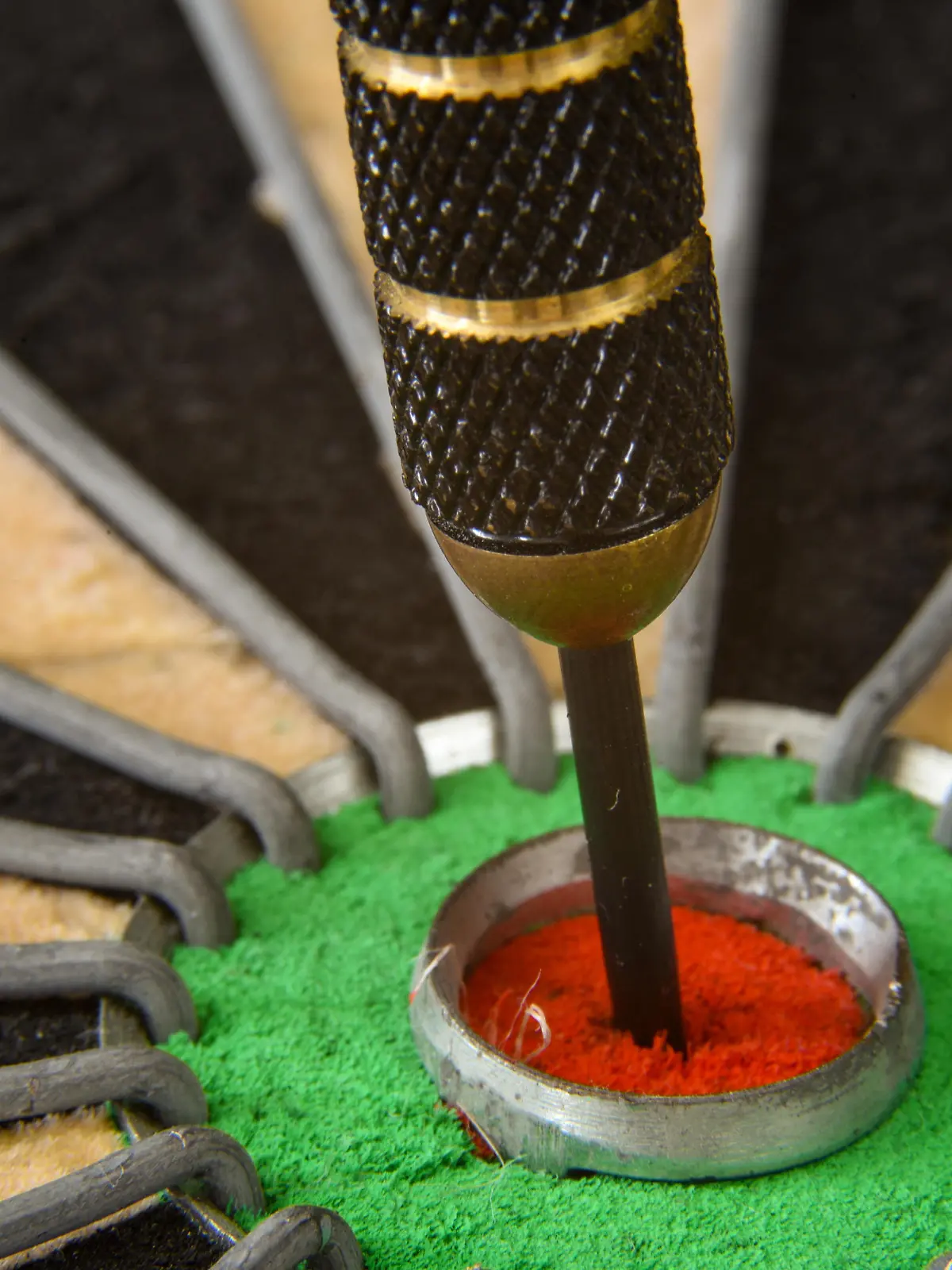 Den Helder, Netherlands. August 2022. Close up of a dart in the bullseye ye of the dartboard. High quality photo