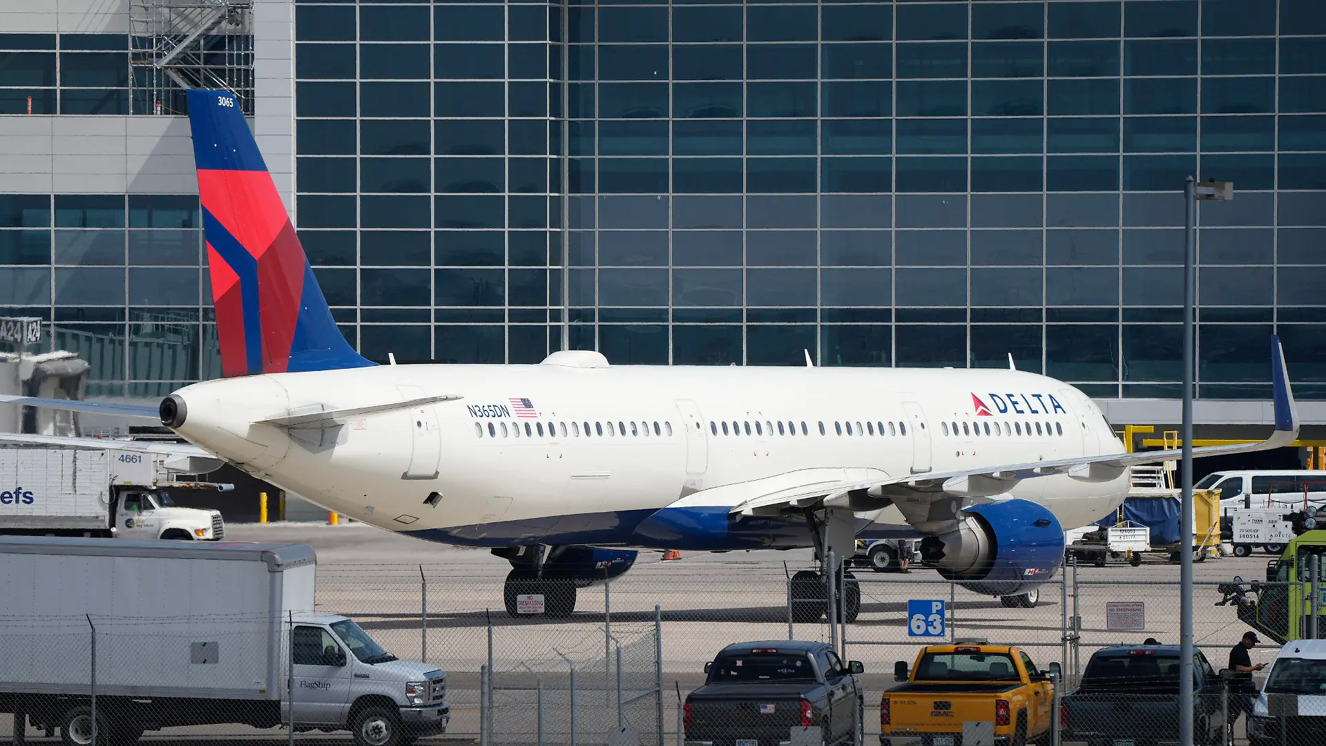 A Delta Airlines jetliner pulls into a gate at Denver International Airport Friday, May 26, 2023, in Denver. (AP Photo/David Zalubowski)