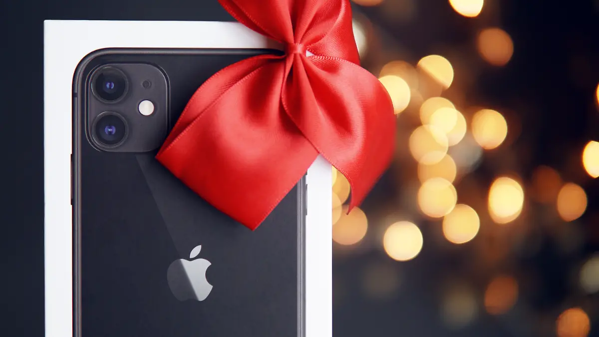 Apple iPhone mit roter Schleife.