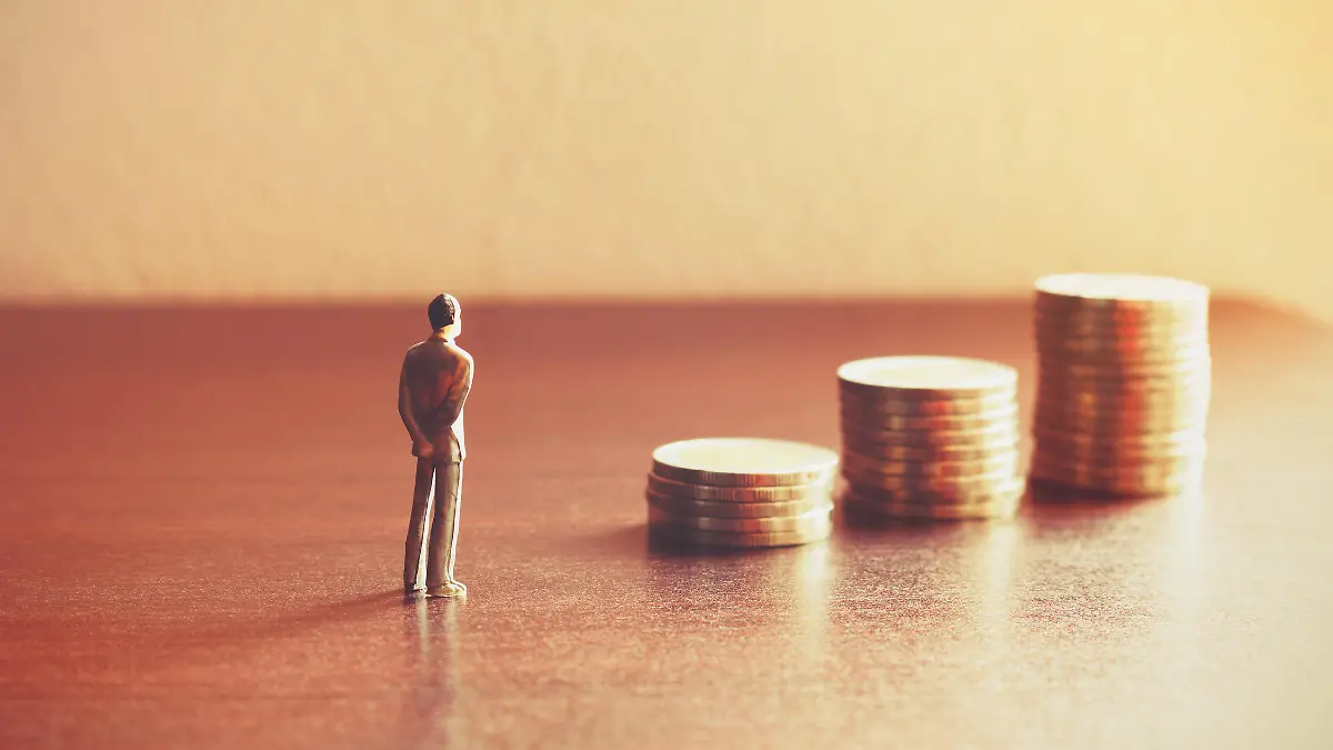 Miniature people looking future with stack coin about financial and money savings concept.
