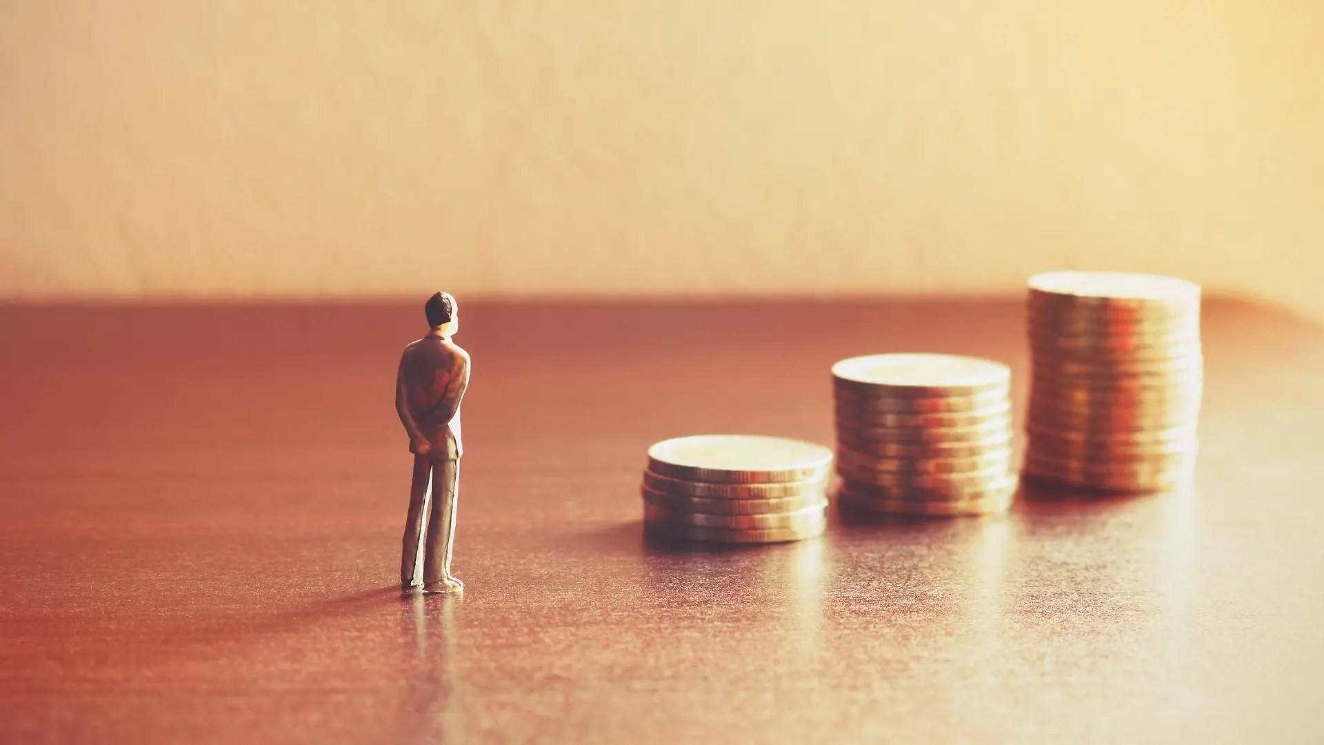 Miniature people looking future with stack coin about financial and money savings concept.