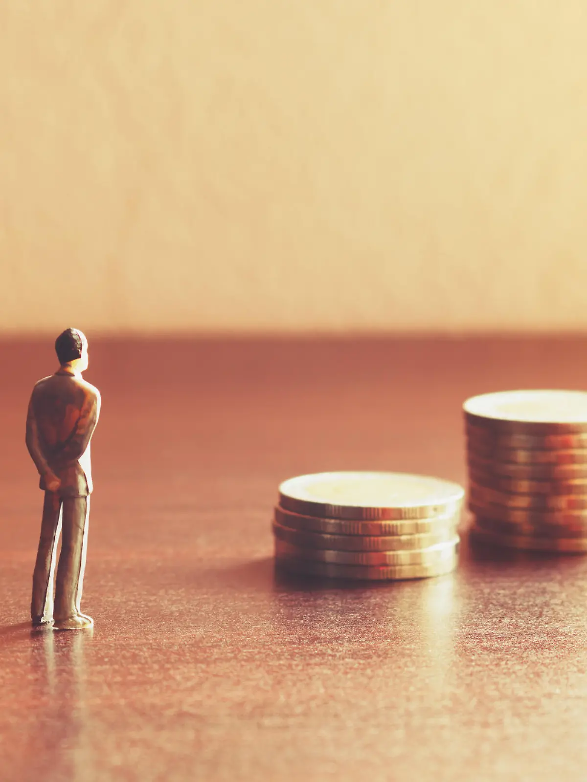 Miniature people looking future with stack coin about financial and money savings concept.