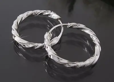 Gedrehte Creolen in Silber