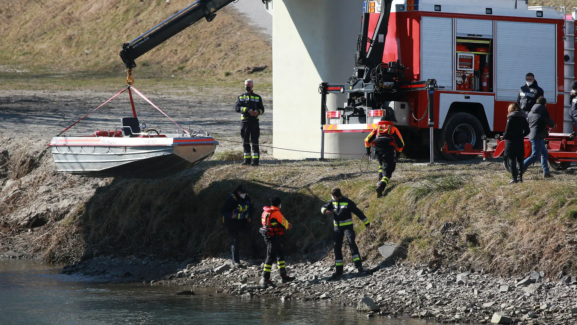 BOLZANO - ADIGE - ETSCH -Peter Neumair's Murder Investigation. Salorno, Salurn, Italy on February 13, 2021. In action rescue squad and Police Investigators using a boat with a dog to search for the body of the father of Benno Neumair in the Adige River. (Photo by Pierre Teyssot/ESPA-Images) Photo via Newscom picture alliance