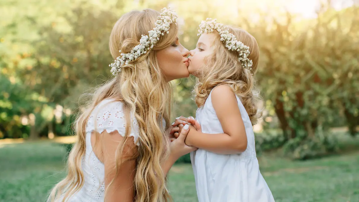 Photo of happy mother and her little daughter