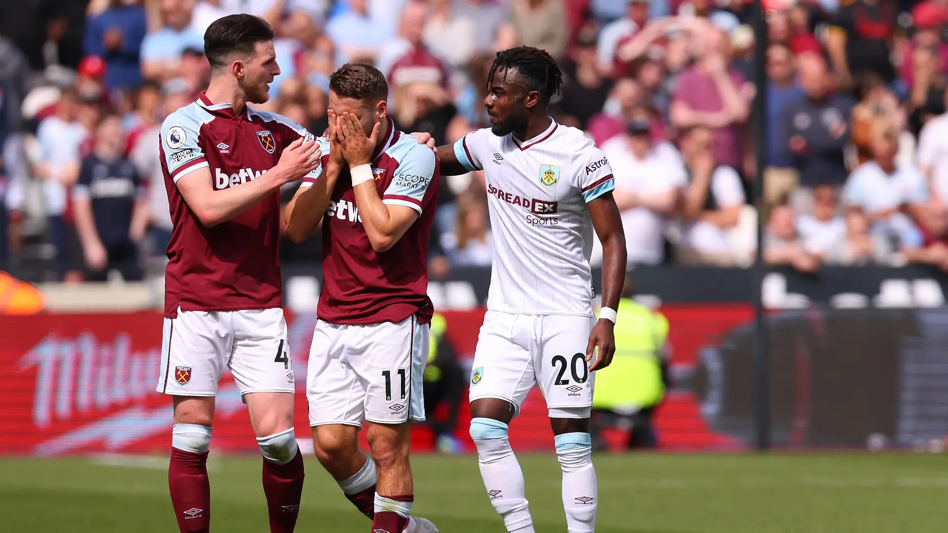  17th April 2022, London Stadium, London, England Premier League football West Ham versus Burnley Nikola Vlasic of West Ham United is consoled by players of both teams as Ashley Westwood is down injured and being attended to by medical staff PUBLICATIONxNOTxINxUK ActionPlus12380349 ShaunxBrooks