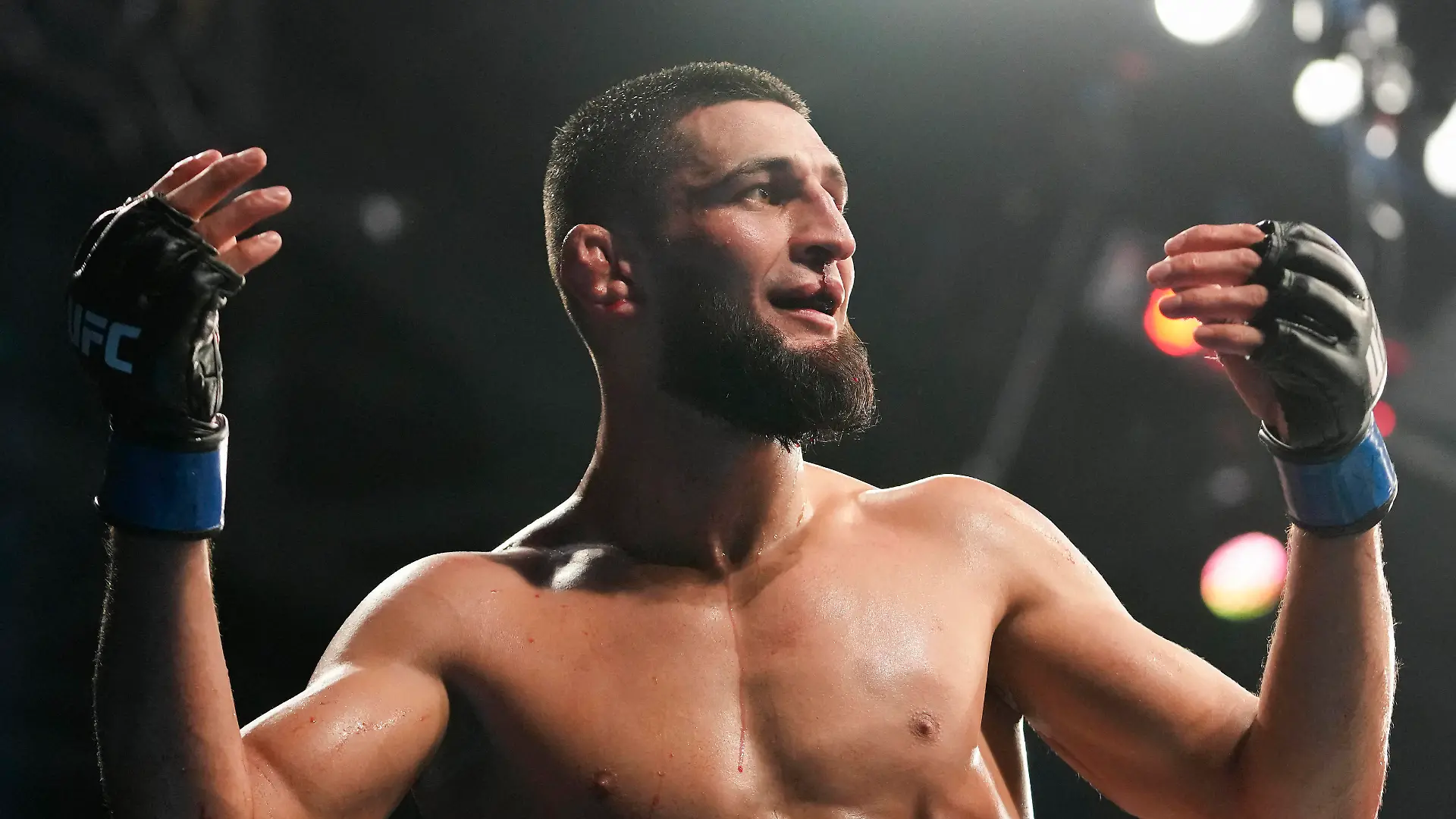 Apr 9, 2022; Jacksonville, Florida, USA; Khamzat Chimaev (blue gloves) after a fight against Gilbert Burns (red gloves) during UFC 273 at VyStar Veterans Memorial Arena. Mandatory Credit: David Yeazell-USA TODAY Sports