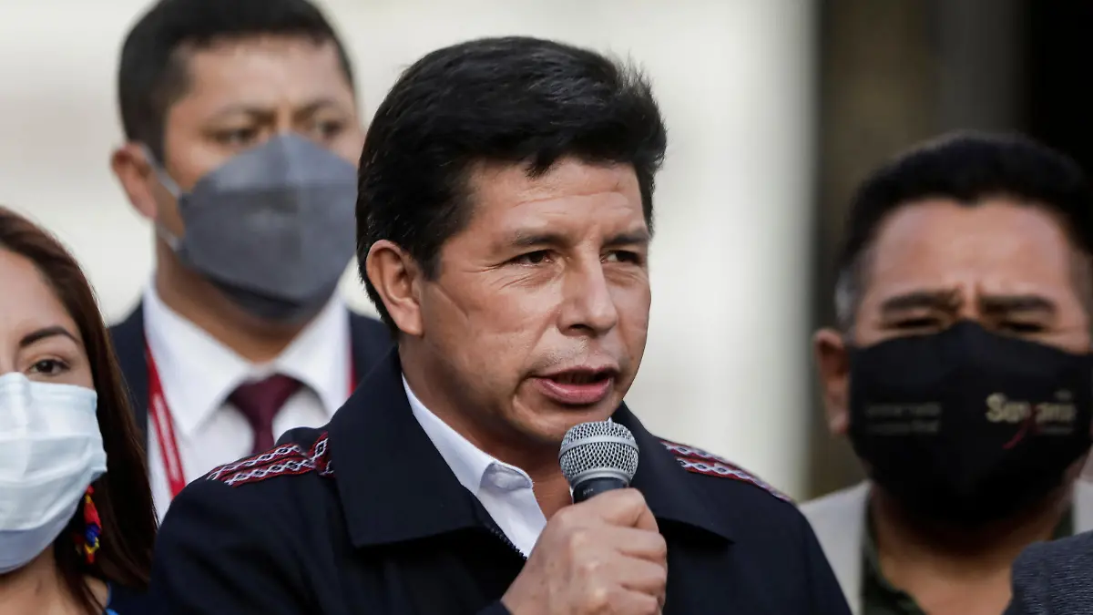 Peru's President Pedro Castillo speaks outside of congress after lifting a curfew in the capital Lima that was imposed over fuel cost protests that spread throughout the country, in Lima, Peru April 5, 2022. REUTERS/Angela Ponce