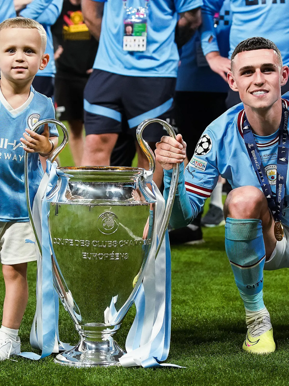 Phil Foden of Manchester City poses with his son Ronnie at the end of the UEFA Champions League final match between Manchester City FC and FC Internazionale at Ataturk Olympic Stadium, Istanbul, Turkey on June 10, 2023. (Photo by Giuseppe Maffia/NurPhoto)