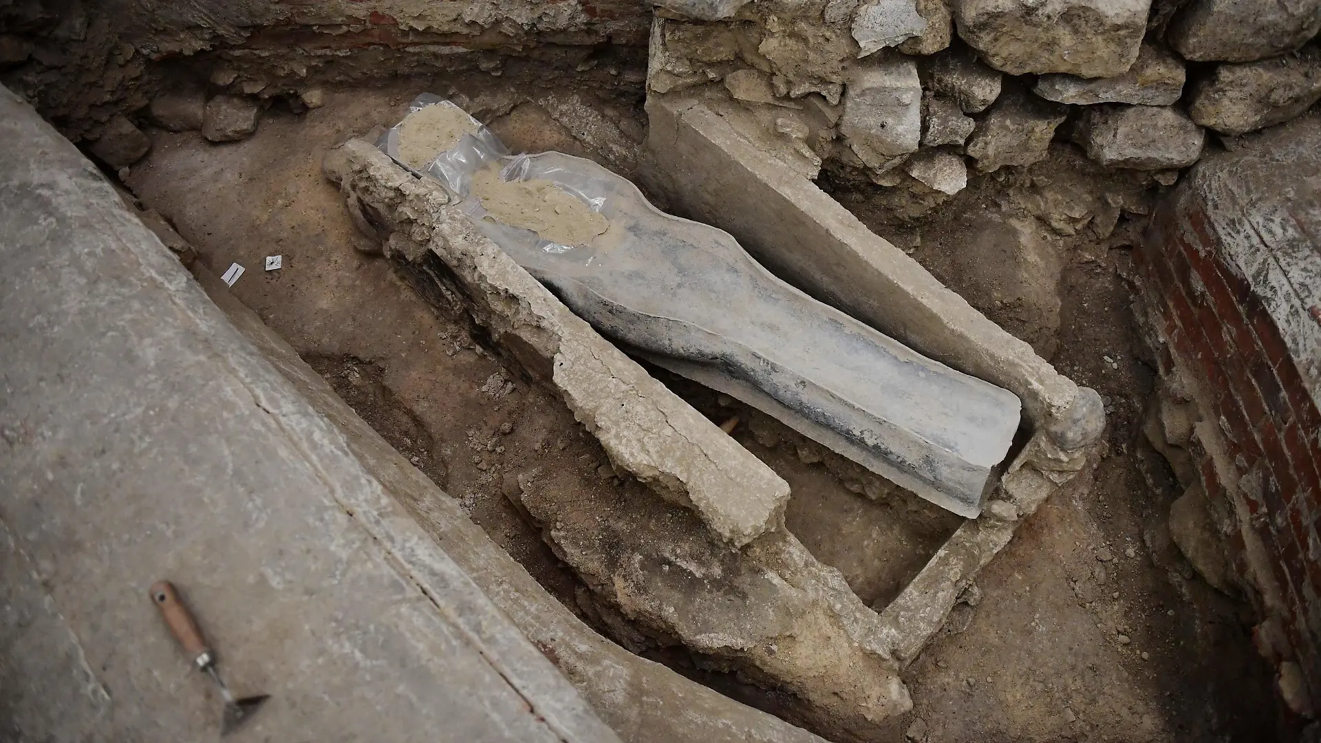 A picture shows a 14th century lead sarcophagus discovered in the floor of Notre Dame Cathedral, in Paris, on March 15, 2022. (Photo by JULIEN DE ROSA / AFP) (Photo by JULIEN DE ROSA/AFP via Getty Images)