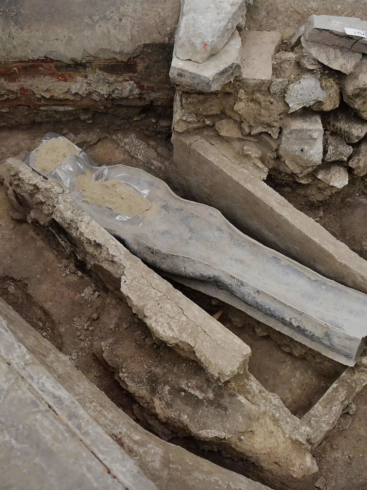 A picture shows a 14th century lead sarcophagus discovered in the floor of Notre Dame Cathedral, in Paris, on March 15, 2022. (Photo by JULIEN DE ROSA / AFP) (Photo by JULIEN DE ROSA/AFP via Getty Images)