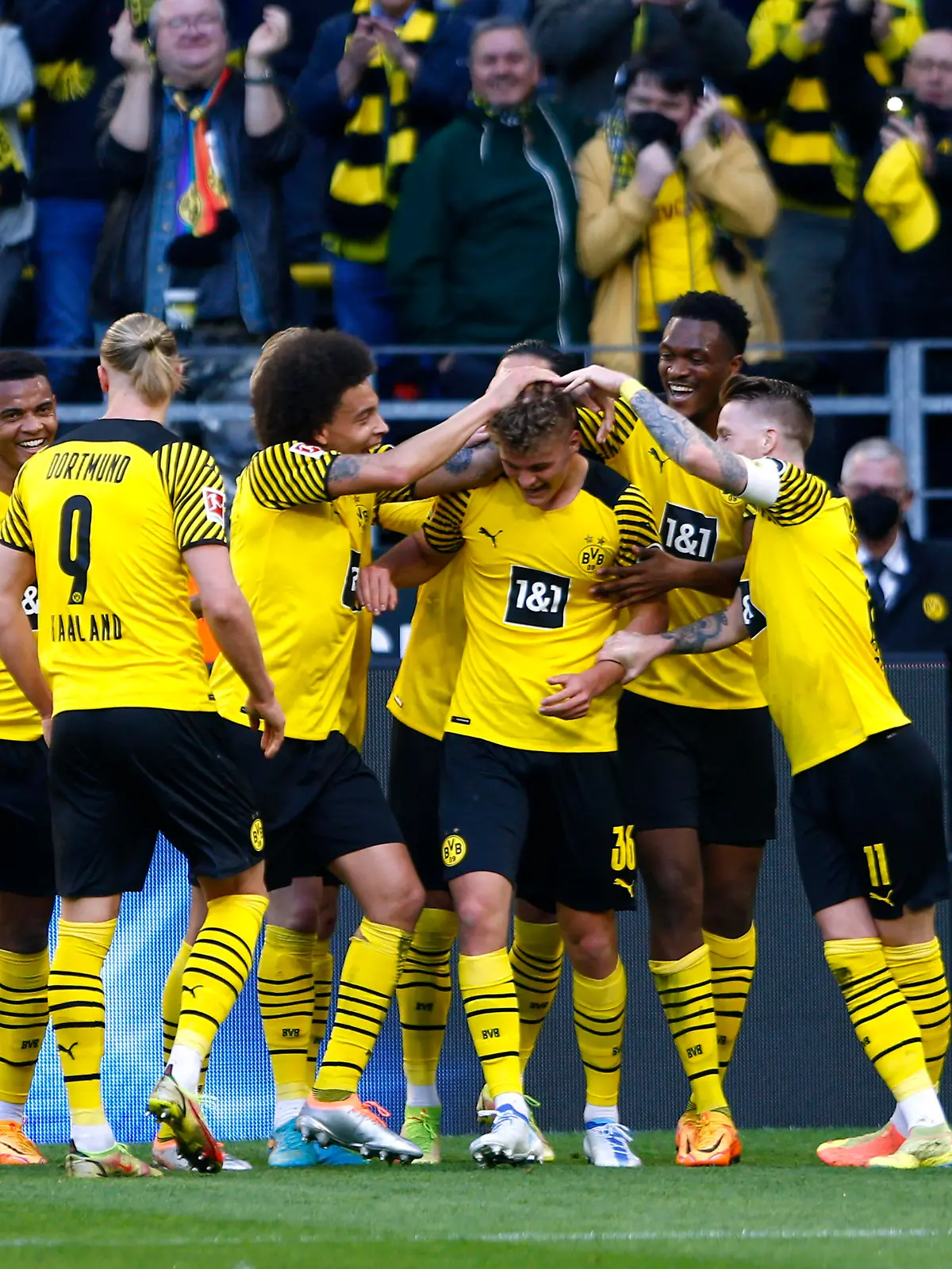 Soccer Football - Bundesliga - Borussia Dortmund v VfL Wolfsburg - Signal Iduna Park, Dortmund, Germany - April 16, 2022 Borussia Dortmund's Tom Rothe celebrates scoring their first goal with teammates REUTERS/Thilo Schmuelgen DFL REGULATIONS PROHIBIT ANY USE OF PHOTOGRAPHS AS IMAGE SEQUENCES AND/OR QUASI-VIDEO.