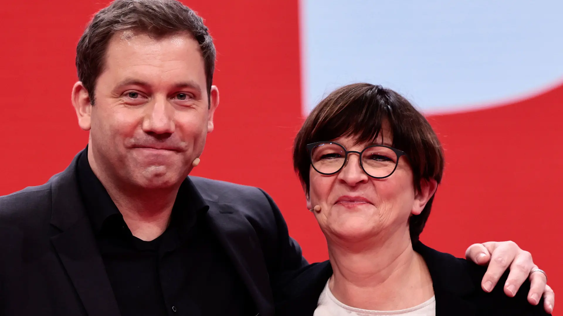 New-elected SPD co-leader Lars Klingbeil, left, poses with re-elected SPD co-leader Saskia Esken, right, pose for a photo during a hybrid party congress of Germany's Social Democratic Party (SPD) in Berlin, Germany, Dec. 11, 2021. (Hannibal Hanschke/Pool Photo via AP)