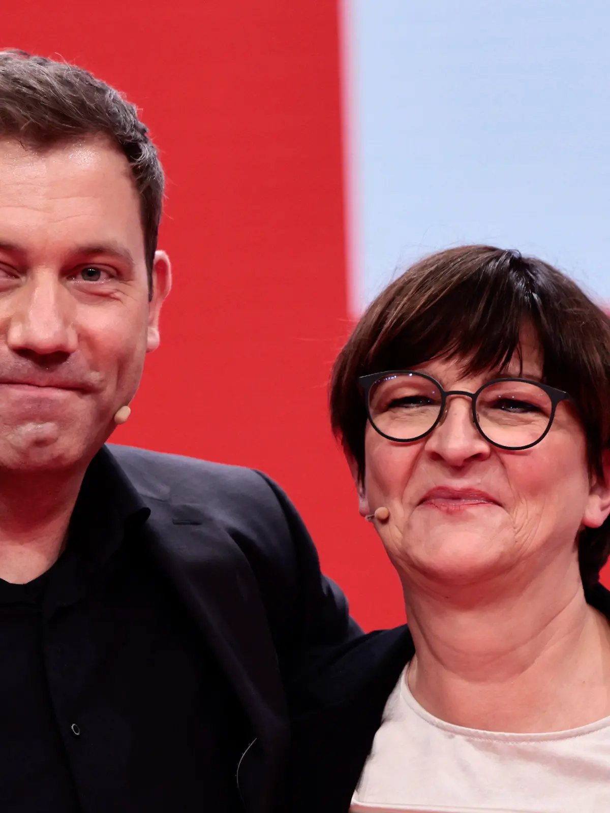 New-elected SPD co-leader Lars Klingbeil, left, poses with re-elected SPD co-leader Saskia Esken, right, pose for a photo during a hybrid party congress of Germany's Social Democratic Party (SPD) in Berlin, Germany, Dec. 11, 2021. (Hannibal Hanschke/Pool Photo via AP)