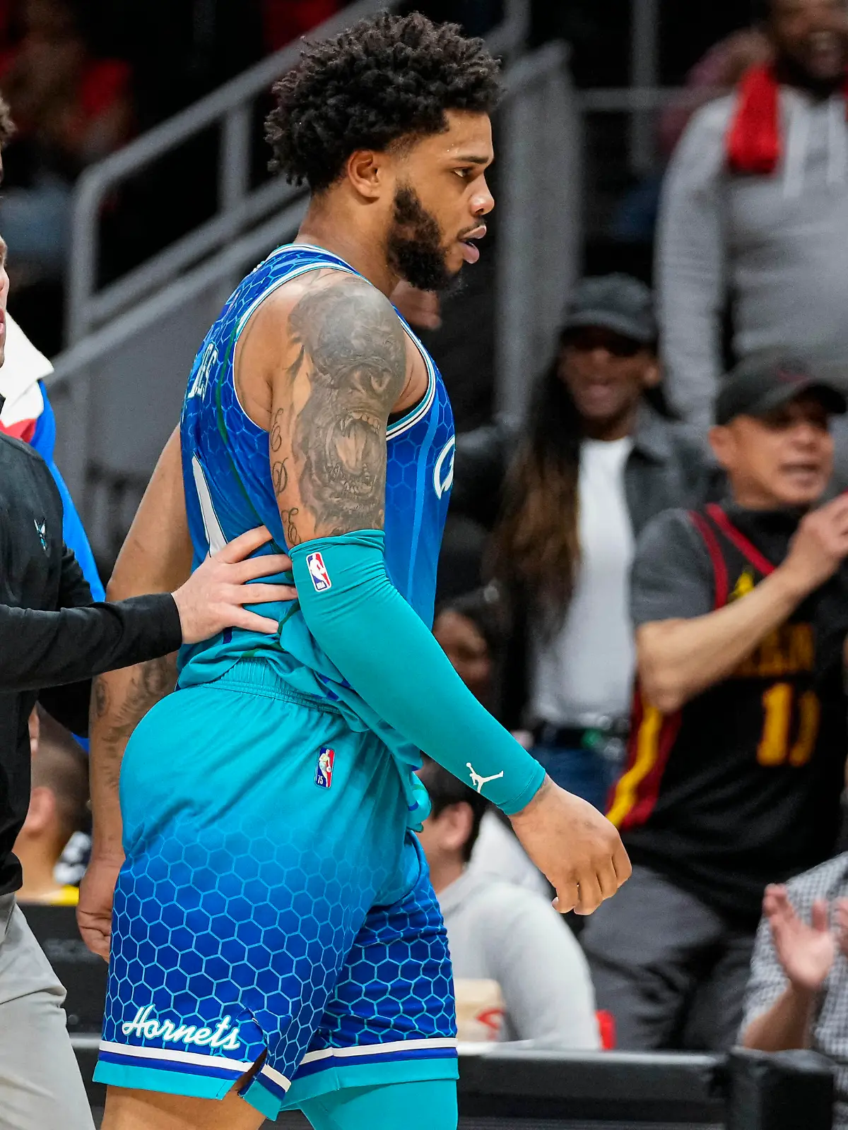 Apr 13, 2022; Atlanta, Georgia, USA; Charlotte Hornets forward Miles Bridges (0) is restrained after being called for a technical foul and being ejected from the game against the Atlanta Hawks during the second half at State Farm Arena. Mandatory Credit: Dale Zanine-USA TODAY Sports
