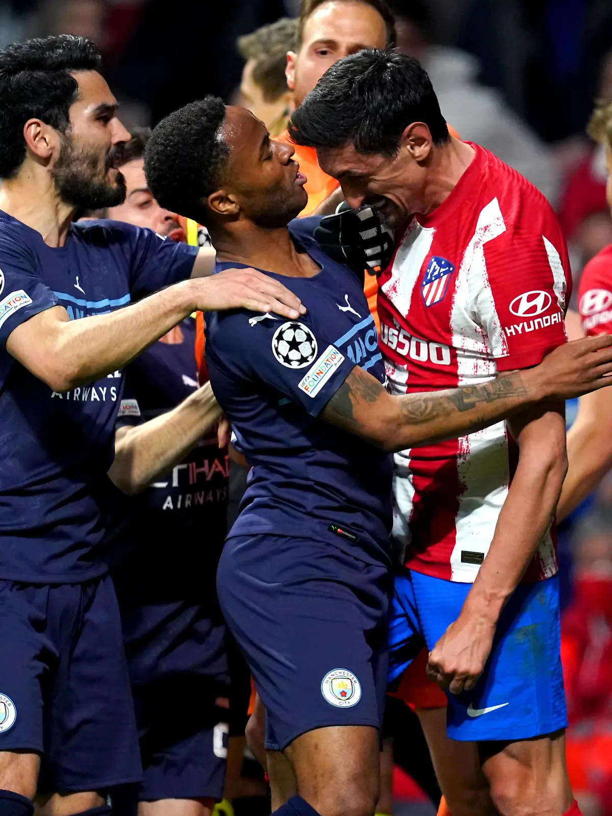  Atletico Madrid v Manchester City - UEFA Champions League - Quarter Final - Second Leg - Wanda Metropolitano Stadium Atletico Madrid s Stefan Savic clashes with Manchester City s Raheem Sterling during the UEFA Champions League quarter final, second leg match at the Wanda Metropolitano Stadium, Madrid. Picture date: Wednesday April 13, 2022. Use subject to restrictions. Editorial use only, no commercial use without prior consent from rights holder. PUBLICATIONxNOTxINxUKxIRL Copyright: xNickxPottsx 66377100