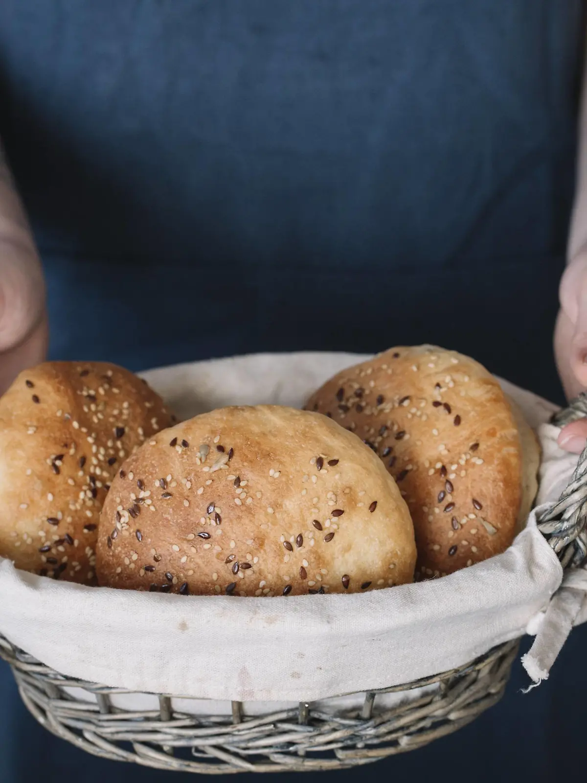Woman holding basket with homemade vegan bread rolls model released Symbolfoto property released PUBLICATIONxINxGERxSUIxAUTxHUNxONLY ALBF00400  