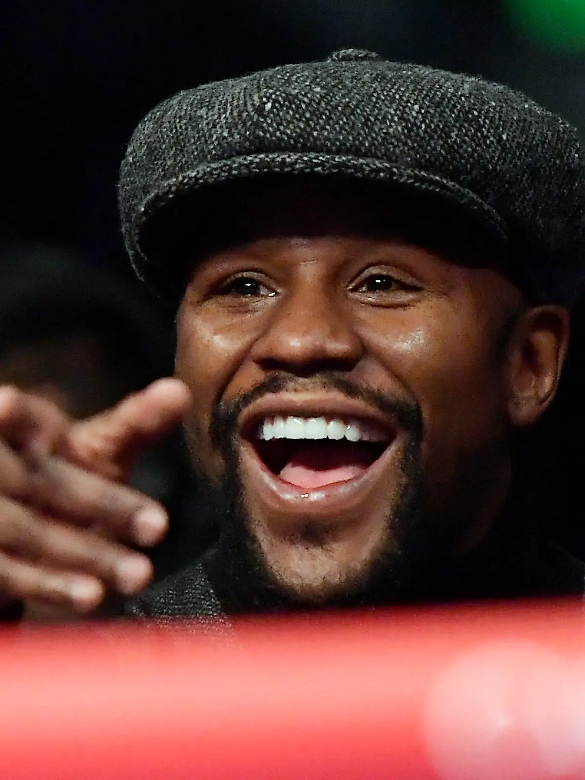 Boxer Floyd Mayweather points to someone in the crowd as he watches a boxing match between Deontay Wilder and Tyson Fury, of England, for the WBC heavyweight championship, Saturday, Dec. 1, 2018, in Los Angeles. (AP Photo/Mark J. Terrill)