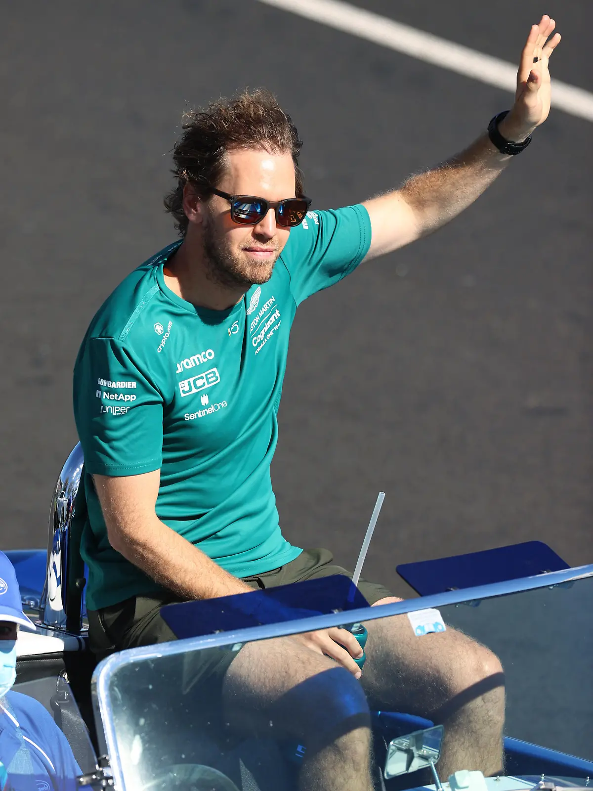MELBOURNE, AUSTRALIA - APRIL 10: Sebastian Vettel of Germany and Aston Martin F1 Team waves to the crowd on the drivers parade ahead of the F1 Grand Prix of Australia at Melbourne Grand Prix Circuit on April 10, 2022 in Melbourne, Australia. (Photo by Robert Cianflone/Getty Images)