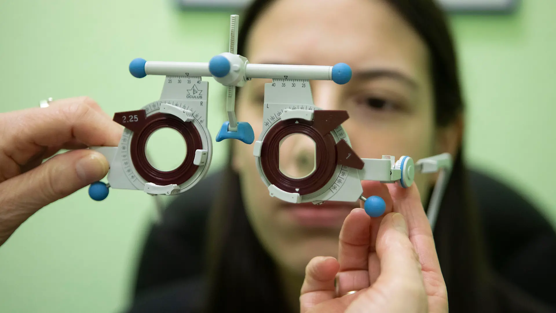 GERMANY, BONN - JANUARY 28: Eye exam, here at an optometrist, on Januarxy 28th, 2021 in Bonn, Germany. Patient female having her eyes measured at the phoropter.