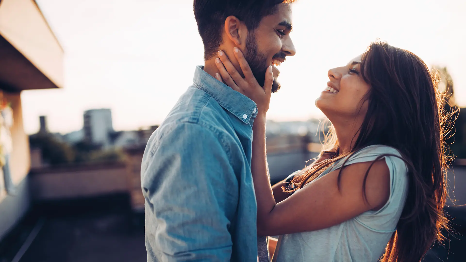 Beautiful young couple in love dating outdoors and smiling