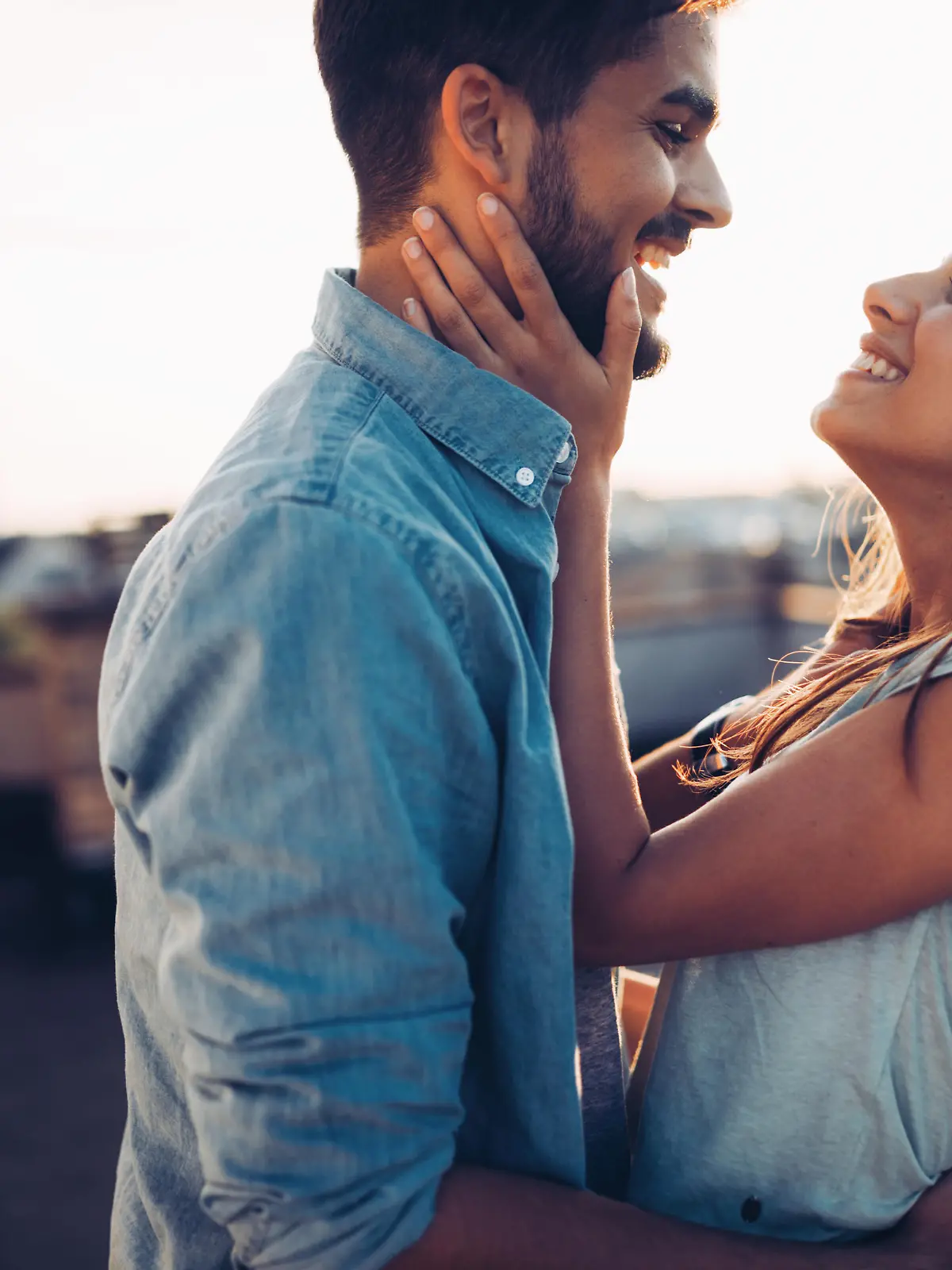 Beautiful young couple in love dating outdoors and smiling