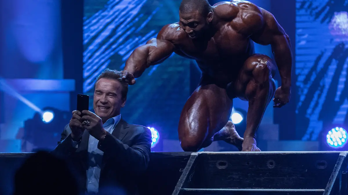 March 4, 2017 - Columbus, Ohio, U.S - Cedric McMillan jumps into a selfie being taken by competition host Arnold Schwarzenegger during his routine in the Arnold Classic at the Arnold Sports Festival in Columbus, Ohio. McMillan won first place in the competition