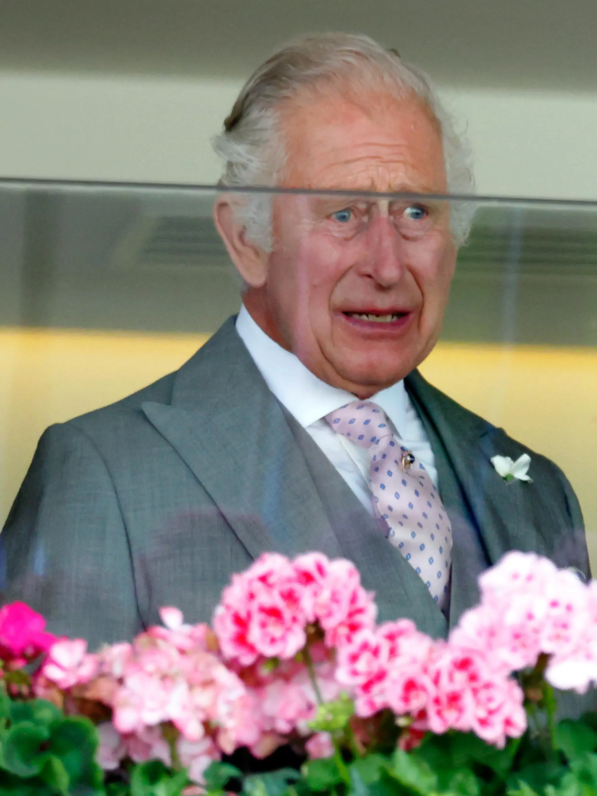 ASCOT, UNITED KINGDOM - JUNE 22: (EMBARGOED FOR PUBLICATION IN UK NEWSPAPERS UNTIL 24 HOURS AFTER CREATE DATE AND TIME) A visibly emotional King Charles III watches from the Royal Box after his horse 'Desert Hero' (which was bred by the late Queen Elizabeth II) won 'The King George V Stakes' on day 3 'Ladies Day' of Royal Ascot 2023 at Ascot Racecourse on June 22, 2023 in Ascot, England. (Photo by Max Mumby/Indigo/Getty Images)