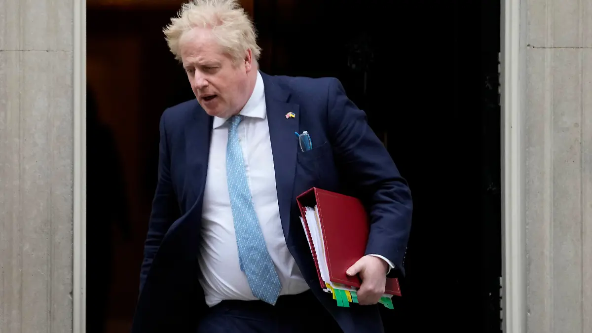 FILE - Britain's Prime Minister Boris Johnson leaves 10 Downing Street to attend the weekly Prime Ministers' Questions session in parliament in London, on March 30, 2022. U.K. Prime Minister Boris Johnson’s office says he will be issued a fine for breaching COVID-19 regulations following allegations of lockdown parties at government offices. Treasury Chief Rishi Sunak will also be fined. (AP Photo/Frank Augstein)