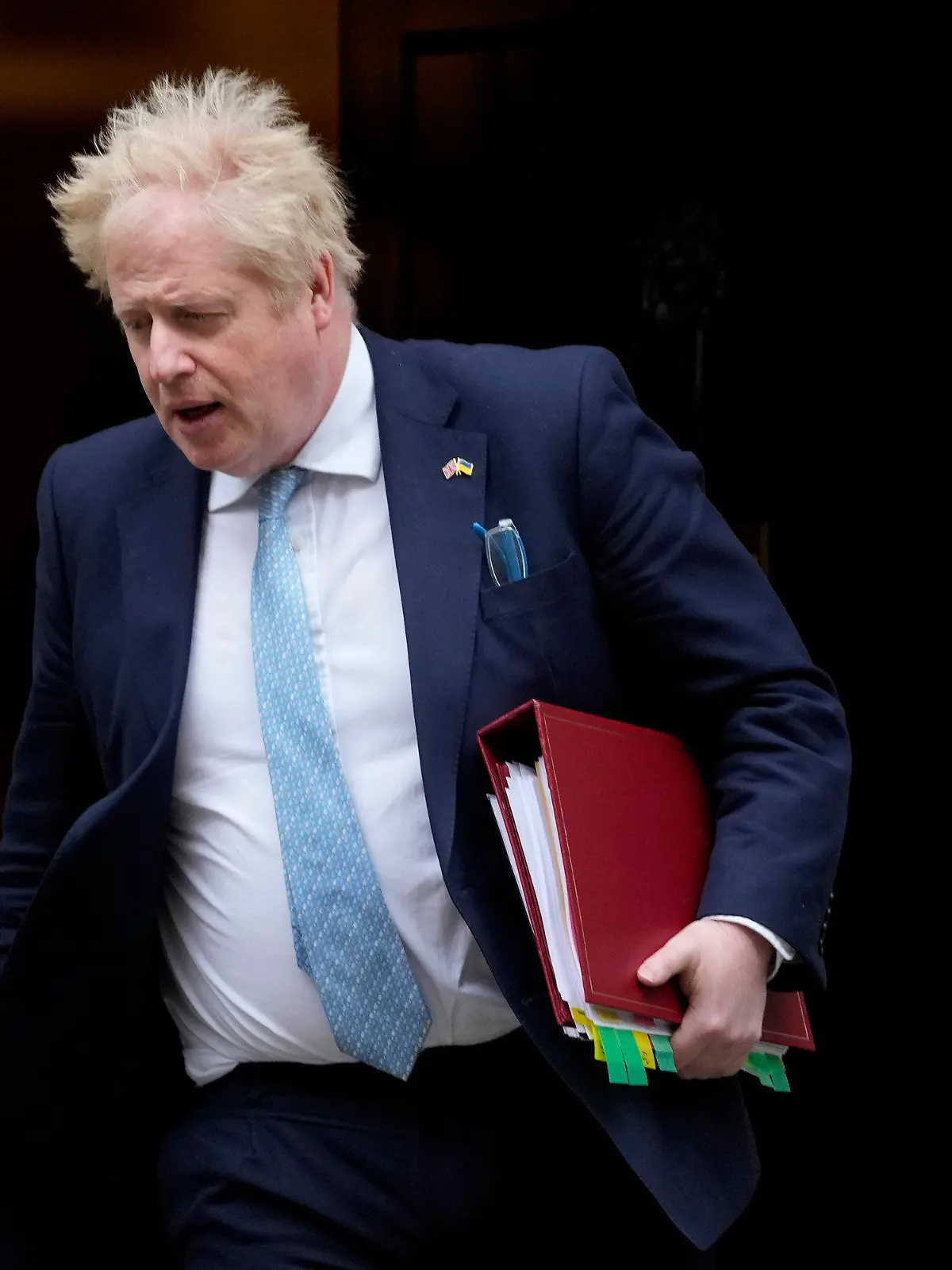 FILE - Britain's Prime Minister Boris Johnson leaves 10 Downing Street to attend the weekly Prime Ministers' Questions session in parliament in London, on March 30, 2022. U.K. Prime Minister Boris Johnson’s office says he will be issued a fine for breaching COVID-19 regulations following allegations of lockdown parties at government offices. Treasury Chief Rishi Sunak will also be fined. (AP Photo/Frank Augstein)