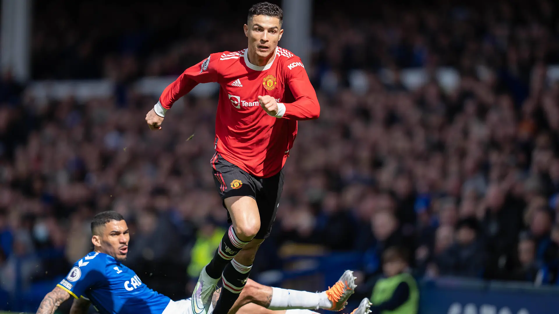 Football - 2021 / 2022 Premier League - Everton vs Manchester United, ManU - Goodison Park - Saturday 9th April 2022 Manchester United s Cristiano Ronaldo is tackled by Everton s Allan PUBLICATIONxNOTxINxUK