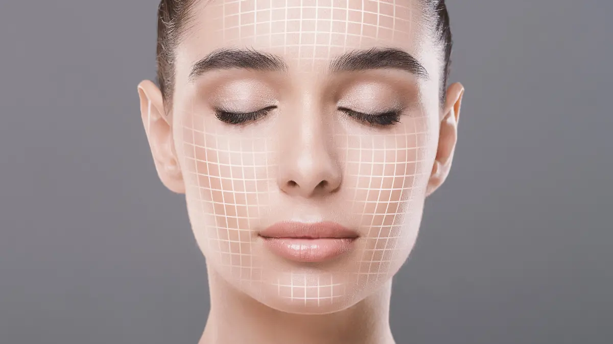 Skin rejuvenation. Cose up portrait of attractive woman with closed eyes with graphic lines on her face over grey studio background