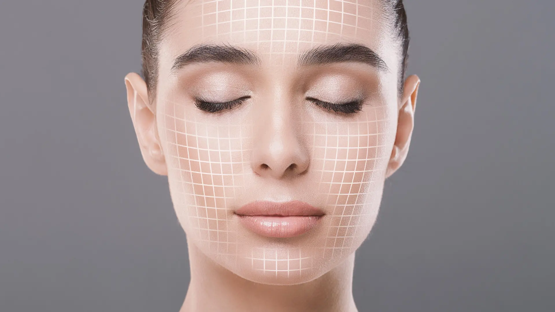 Skin rejuvenation. Cose up portrait of attractive woman with closed eyes with graphic lines on her face over grey studio background