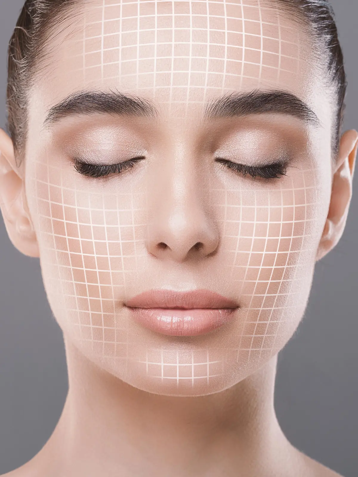 Skin rejuvenation. Cose up portrait of attractive woman with closed eyes with graphic lines on her face over grey studio background