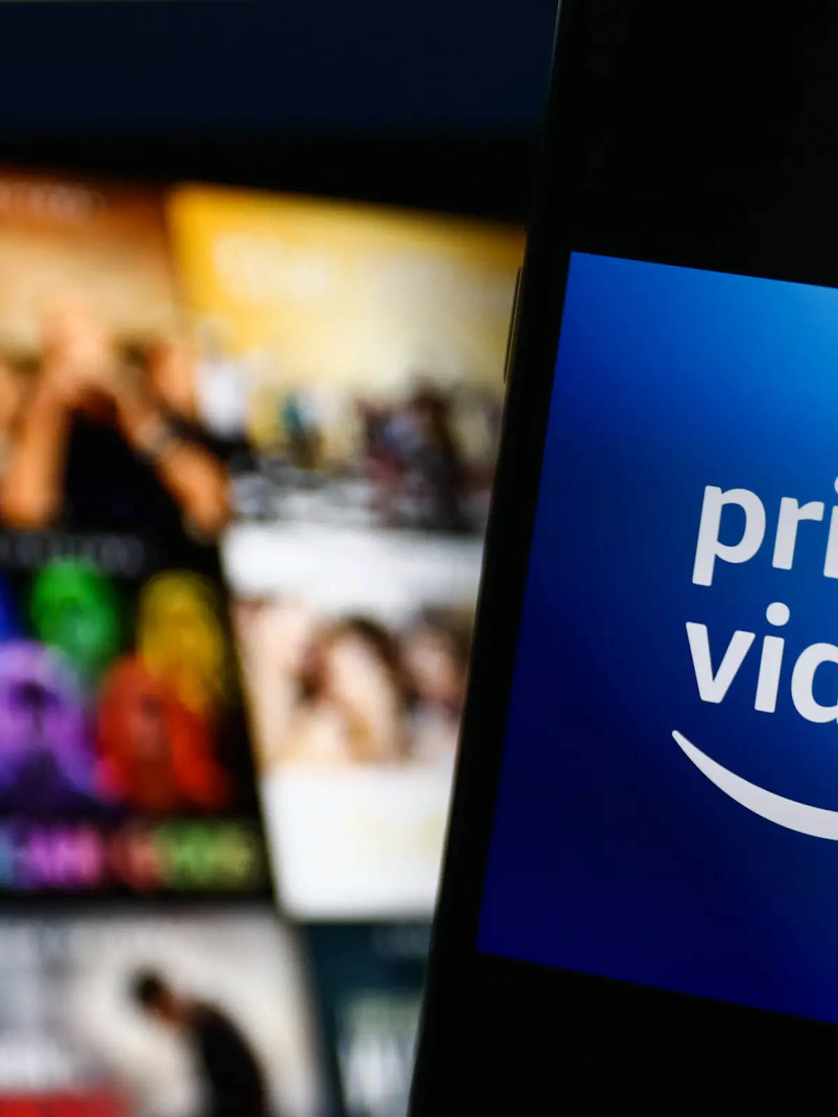 Amazon Prime Video logo displayed on a phone screen and Amazon Prime Video website displayed on a screen in the background are seen in this illustration photo taken in Krakow, Poland on July 26, 2022. (Photo by Jakub Porzycki/NurPhoto)