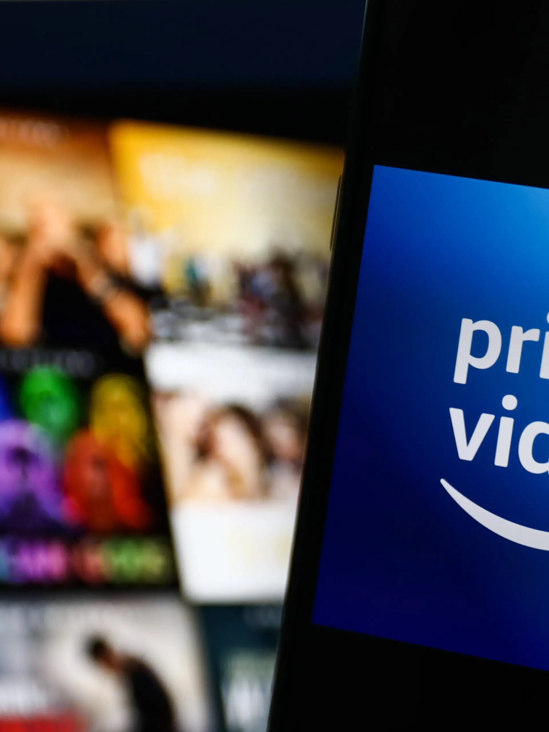 Amazon Prime Video logo displayed on a phone screen and Amazon Prime Video website displayed on a screen in the background are seen in this illustration photo taken in Krakow, Poland on July 26, 2022. (Photo by Jakub Porzycki/NurPhoto)