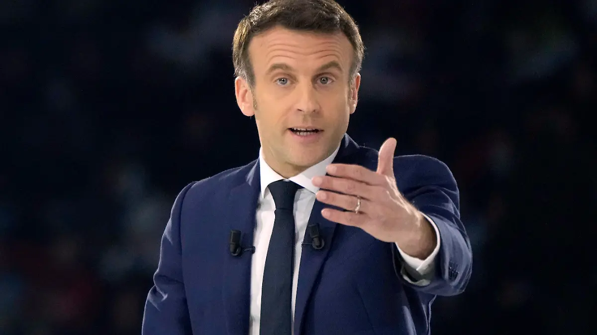 FILE - French President Emmanuel Macron and centrist candidate for reelection delivers his speech during a meeting in Paris, Saturday, April 2, 2022. Emmanuel Macron has been at the forefront of international talks on how to support Ukraine and take sanctions against Russia. The situation tended to enhance his stature as world leader and boosted his popularity in polls. Macron vowed to keep investing in the French military and "significantly" reinforcing European armies' capacities and cooperation. (AP Photo/Francois Mori, File)