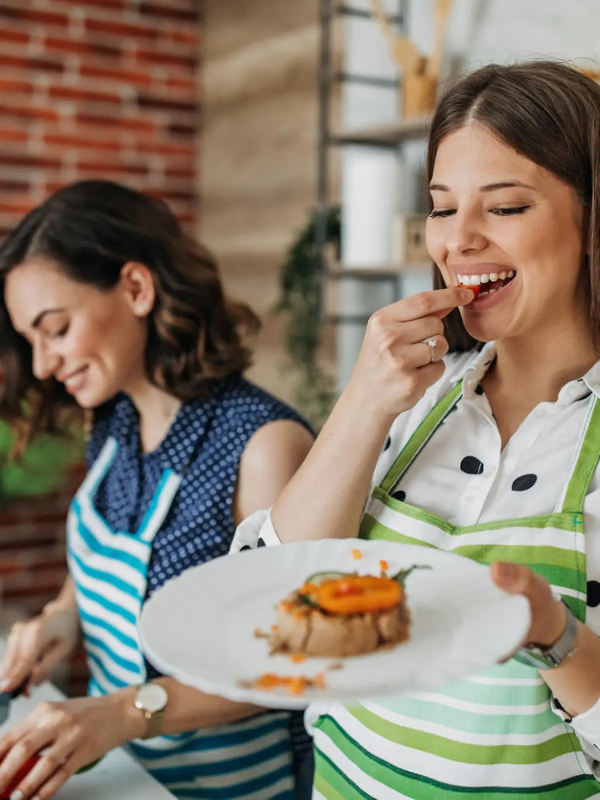 Young women preparing food in the kitchen