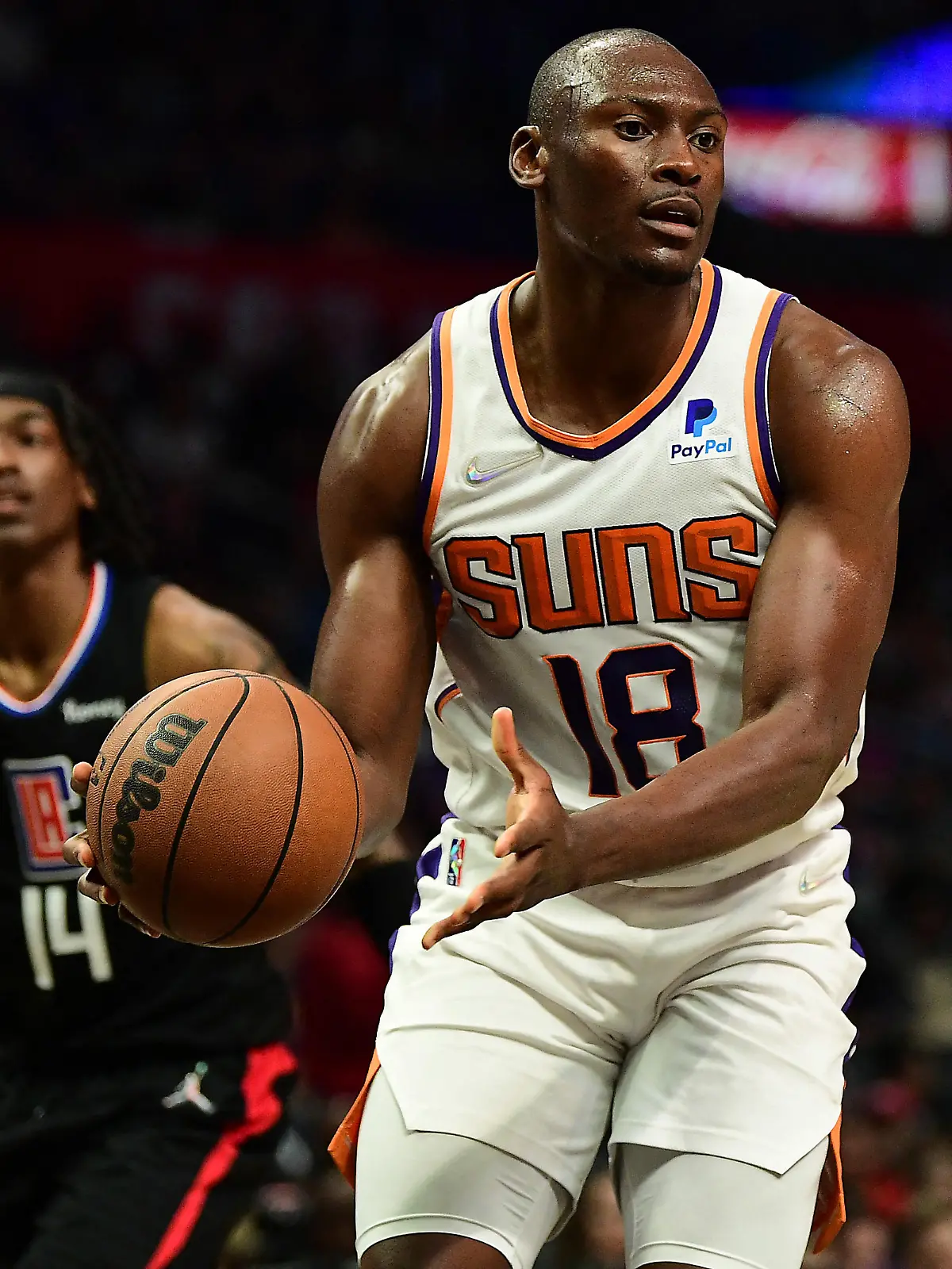 Apr 6, 2022; Los Angeles, California, USA; Phoenix Suns center Bismack Biyombo (18) controls the ball against the Los Angeles Clippers during the second half at Crypto.com Arena. Mandatory Credit: Gary A. Vasquez-USA TODAY Sports